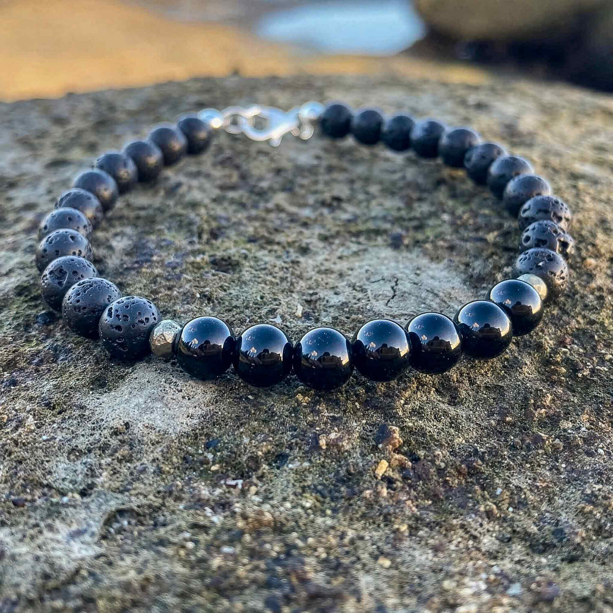 Inner Strength bracelet on grey stone, sterling silver clasp at the back