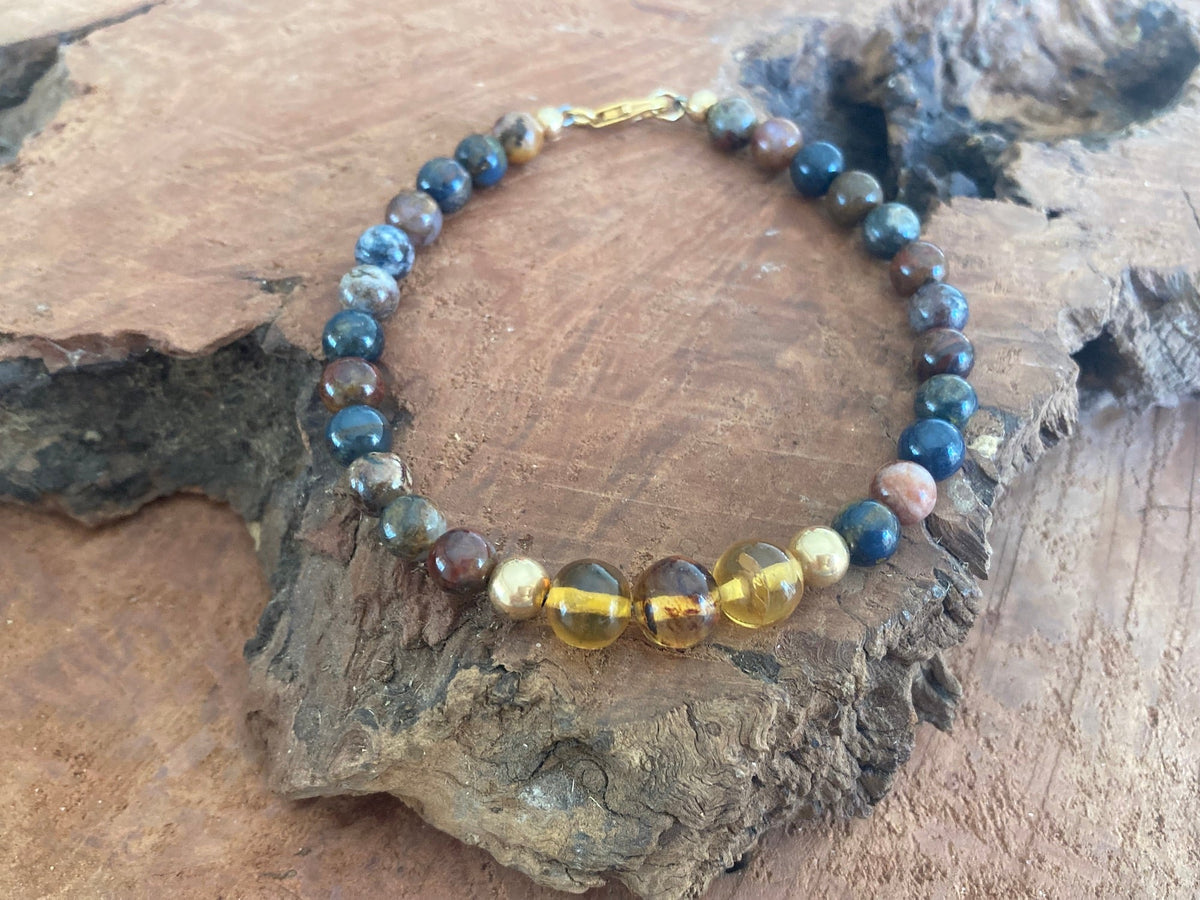 The Catalyst bracelet on driftwood, seen from a lower angle
