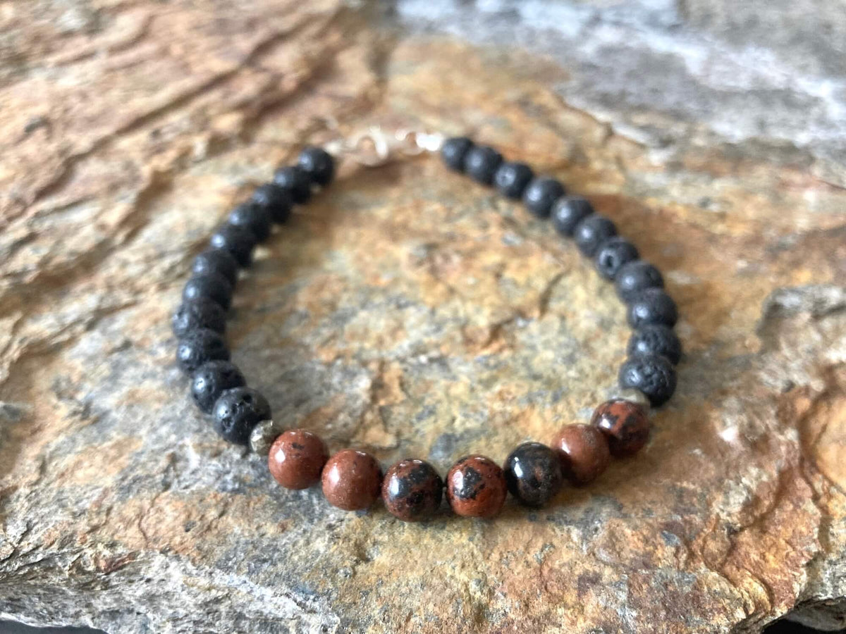 Close-up of mahogany red obsidian beads on the Self-Acceptance bracelet