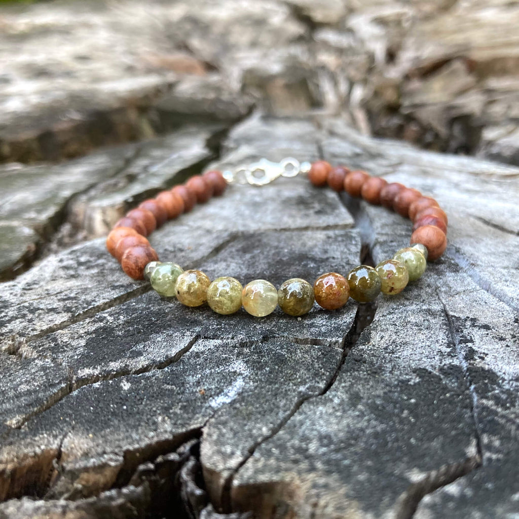 Growth men's bracelet: green garnet with natural wood beads, on a weathered stump
