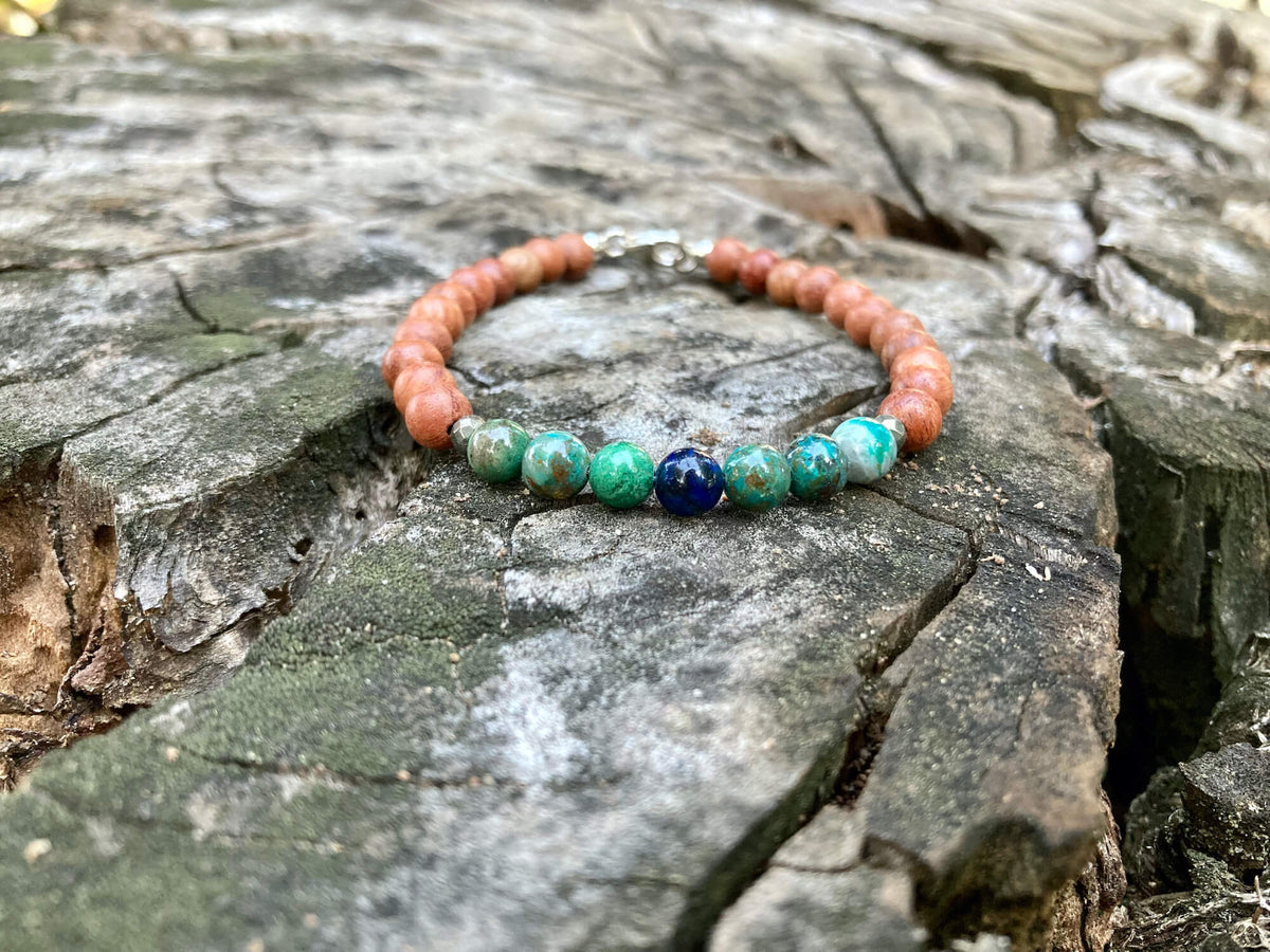 Inner Wisdom bracelet on a weathered tree stump