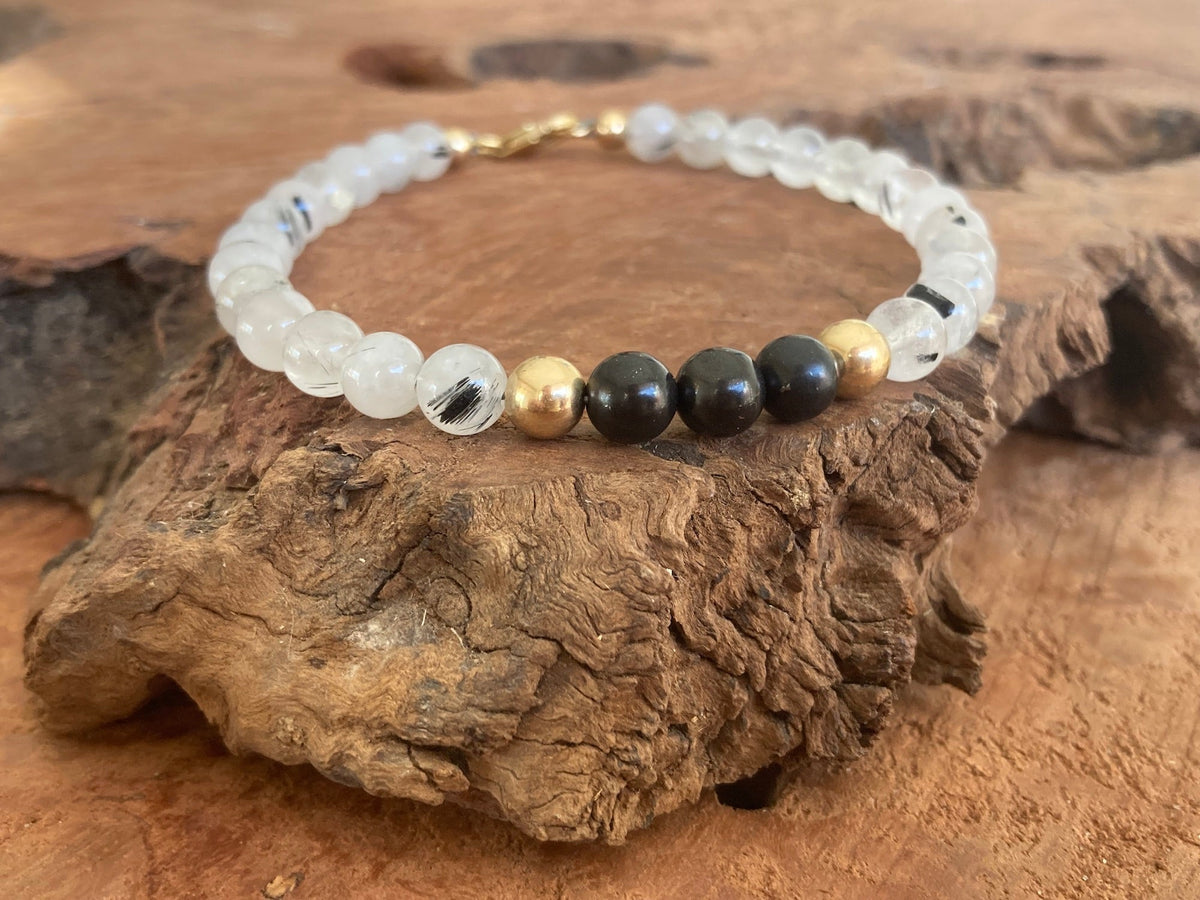 The Integrator bracelet from the side on weathered wood