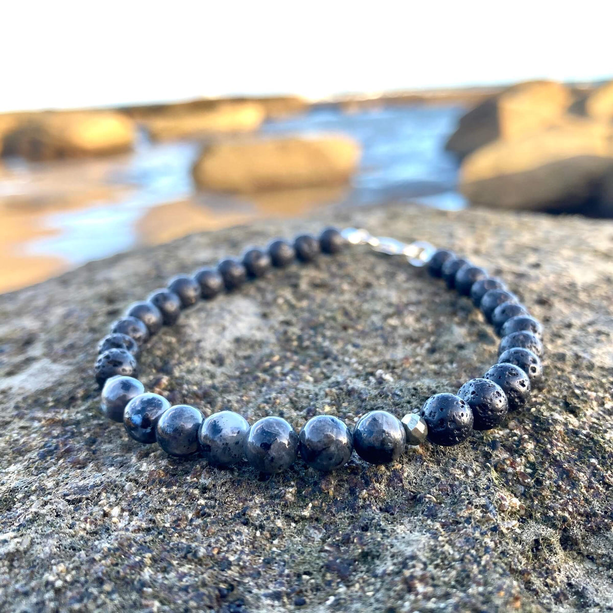 Transformation bracelet on volcanic rock, seen from a low angle
