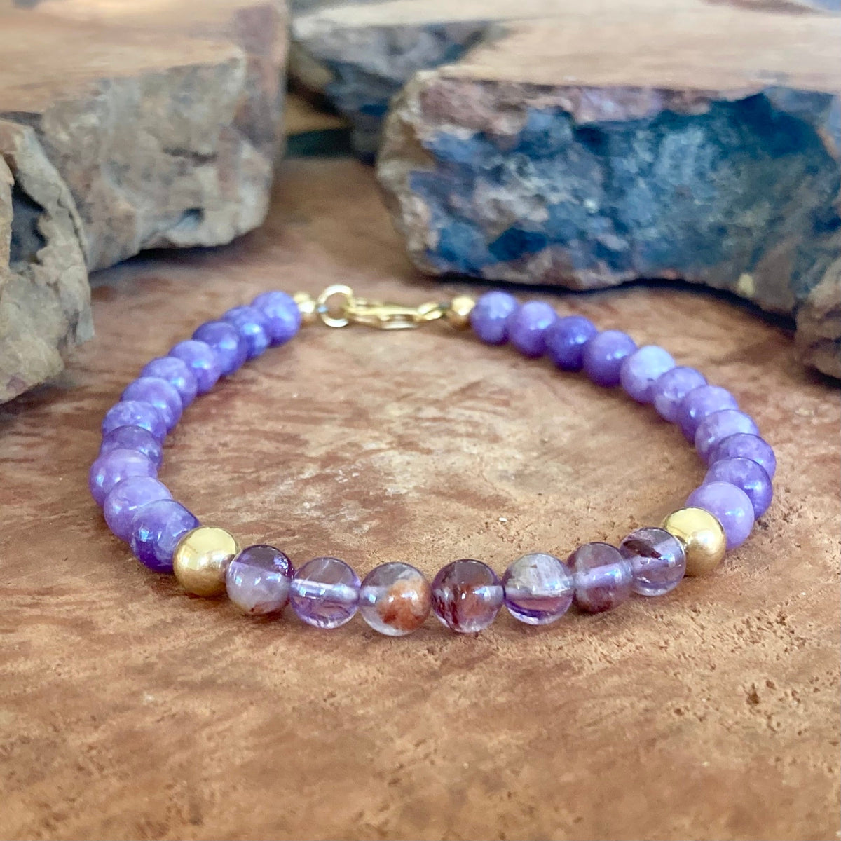 The Visionary men's bracelet: lavender phosphosiderite with purple lodolite and 14k gold-fill beads, on wood
