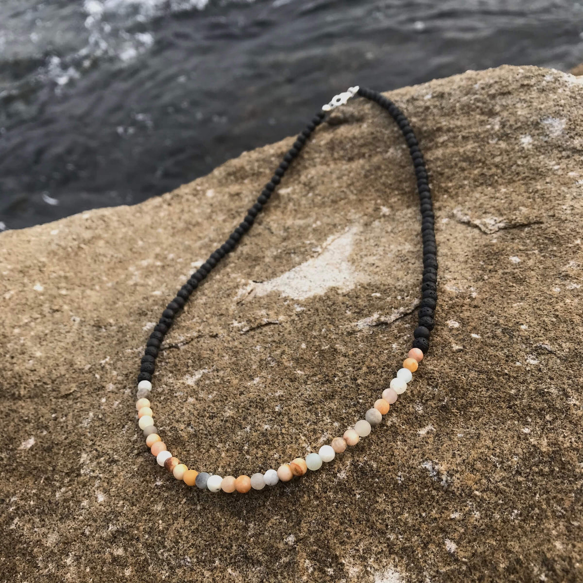 Vitality necklace laid on coastal rock